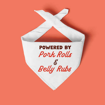 White bandana with text 'Powered by Pork Rolls & Belly Rubs' on a peach background